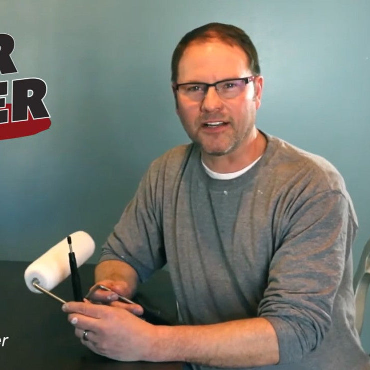 Man holding a roller with 'Roller Stopper' branding and Bret Anderson's name displayed.